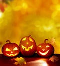 Pumpkins head jack o lantern on wooden table .Halloween background