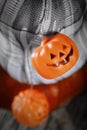 Pumpkins and jack-o`-lantern lights, closeup view. Halloween decorations