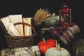 Pumpkins and a kerosene lamp. Dry bouquet. Firewood in a basket. Harvesting. Thanksgiving Day. Wallpaper