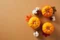 Pumpkins, maple leaves, cotton on beige background. Flat lay, top view, copy space. Happy Thanksgiving holiday banner design Royalty Free Stock Photo