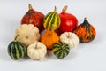 Pumpkins and Patison of various colors and fancy shapes on white. Pumpkins for Halloween. Royalty Free Stock Photo
