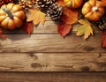 Pumpkins, pine cones, and fall leaves adorn a rustic wood surface, evoking a cozy autumn ambiance