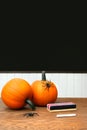 Pumpkins on school desk in classroom