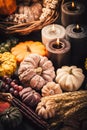 Pumpkins on wooden table - Thanksgiving, fall themed holiday table setting arrangement for a seasonal party Royalty Free Stock Photo