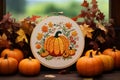 Pumpkinthemed embroidery hoop art showcasing a