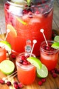 Punch bowl and glasses of cranberry pineapple punch