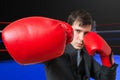 Punch of boxing businessman in suit. Fighting concept