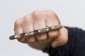 A punch with brass knuckles Royalty Free Stock Photo