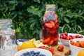 Punch made from organic fruits and berries. Refreshing alcohol-free summer drink with ice and fruit juice. Homemade drink Royalty Free Stock Photo