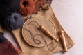 Punch needle tool composition with a burlap fabric in a embroidery hoop and a threaded needle with a wool thread Royalty Free Stock Photo