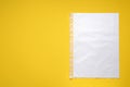 Punched pocket with paper sheet on yellow background, top view. Space for text Royalty Free Stock Photo