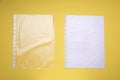 Punched pockets on yellow background, flat lay. Space for text Royalty Free Stock Photo