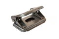 The puncher is metallic gray. Old vintage hole punch on a white background Royalty Free Stock Photo