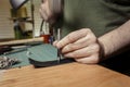 Punching a Hole for a Rivet Into Leather Strip