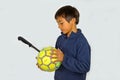 Boy With A Knife Punctured Football Ball Royalty Free Stock Photo