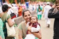 Pune, India. 28/June/2019. A woman holds the baby for portrait during Palkhi Pilgrimage aka Pandharpur Wari. Royalty Free Stock Photo