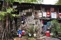 PUNE, INDIA, March 2012, Woman climbing down wooden staircase in old chawl