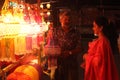 Pune, India - November 2018: An Indian shopkeeper selling his be