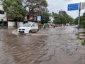 PUNE, Maharashtra, 03 Dec 2021, Peoples drive through waterlogged during heavy rain at BT Kawde Road in Pune. D, flooded roads Royalty Free Stock Photo