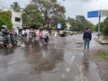 PUNE, Maharashtra, 03 Dec 2021, Peoples drive through waterlogged during heavy rain at BT Kawde Road in Pune. D, flooded roads Royalty Free Stock Photo