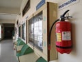 Pune, Maharashtra - December 05, 2022: Fire extinguisher hanging on wall in college