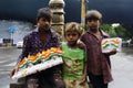 PUNE, MAHARASHTRA, INDIA, 15 Aug 2018, Street boys sell Indian flag table stand or car stand on the occasion of Independence Day