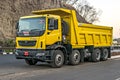 Pune, Maharashtra,India-March 14th, 2020: Brand new , fresh, yellow Tata Prima , model 3130K teeper truck under trial on highway