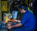 Skilled operator doing electrode welding work in a small industry