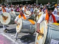 Group of young boys & girls, beating traditional dhol & tasha co