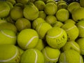 Close up of group of yellow tennis balls in mall for sell