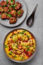 Punjabi Kadhi Pakora in gray bowl on concrete table top. Kadhi Pakoda is indian cuisine curry dish. Asian food and meal Royalty Free Stock Photo