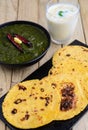 Punjabi meal-Sarso saag(greens) served with Indian maize(makka) flat bread Royalty Free Stock Photo