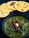 Punjabi meal-Sarso saag(greens) served with Indian maize(makka) flat bread Royalty Free Stock Photo