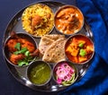 Indian non-vegetarian Meal -Butter Chicken, rajma, biryani with roti and salad Royalty Free Stock Photo