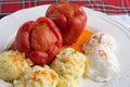 Stuffed peppers plate served with mashed potatoes and cream cheese called Kajmak