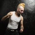 Punk with clenched fists.