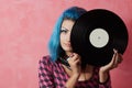 Punk girl DJ with dyed turqouise hair Royalty Free Stock Photo