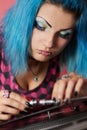 Punk girl DJ with dyed turqouise hair Royalty Free Stock Photo