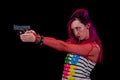 Punk girl shooting a pistol double handed. Royalty Free Stock Photo