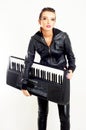 Punk rock fashion girl with a piano Royalty Free Stock Photo