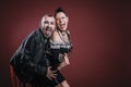 punky style man and woman pose in studio with cheerful expression Royalty Free Stock Photo