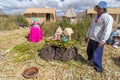 Puno, Peru - circa June 2015: Family at Uros floating island and village on Lake Titicaca near Puno, Peru