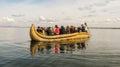 Puno, Peru - Circa May 2014: Tourists on a traditional reed boat in Lake Titicaca near Puno