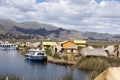 Puno, Peru -. Traditional Totora boat with tourists on Lake Titicaca near the floating islands of Uros, Puno, Peru, Royalty Free Stock Photo