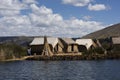 Puno, Peru -Traditional Totora boat with tourists on Lake Titicaca near the floating islands of Uros, Puno, Peru, Royalty Free Stock Photo