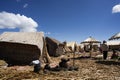 Puno, Peru -. Traditional Totora boat with tourists on Lake Titicaca near the floating islands of Uros, Puno, Peru, Royalty Free Stock Photo