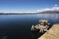 Puno, Peru -. Traditional Totora boat with tourists on Lake Titicaca near the floating islands of Uros, Puno, Peru, Royalty Free Stock Photo