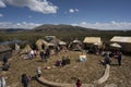 Puno, Peru - Traditional Totora boat with tourists on Lake Titicaca near the floating islands of Uros, Puno, Peru, Royalty Free Stock Photo