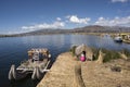 Puno, Peru -Traditional Totora boat with tourists on Lake Titicaca near the floating islands of Uros, Puno, Peru, Royalty Free Stock Photo