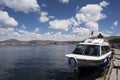 Puno, Peru Traditional Totora boat with tourists on Lake Titicaca near the floating islands of Uros, Puno, Peru, Royalty Free Stock Photo